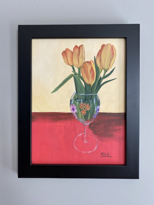 Close up painting of peach tulips in a wine glass