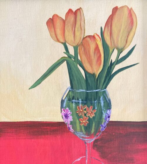 Close up painting of peach tulips in a wine glass