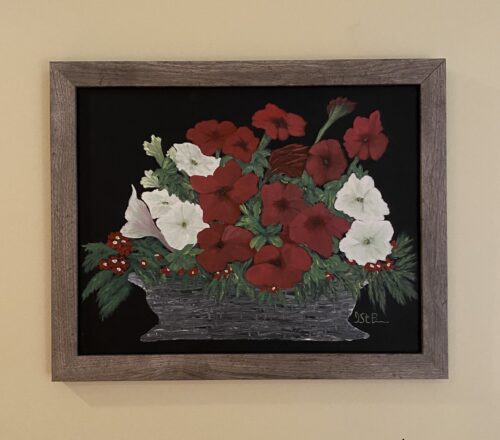 Painting of red and white petunia flowers in a basket