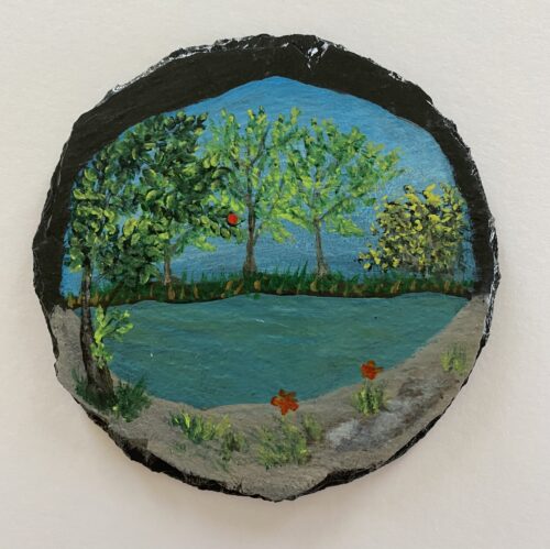 Coaster painted with an image of a pond and trees