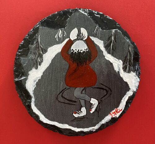 Coaster with a painting of a girl in a red jacket skating on it