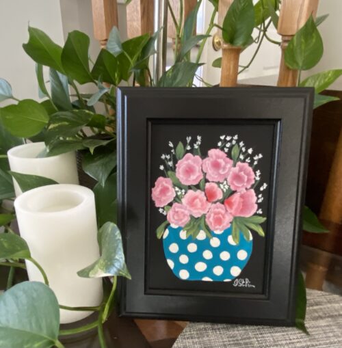 Painting of pink mini carnations in a blue and white polka dot pot