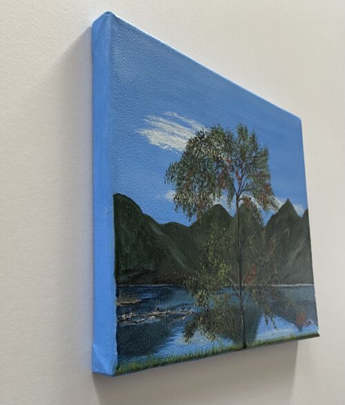 Painting of a leafy tree in front of a lake with mountains in the background