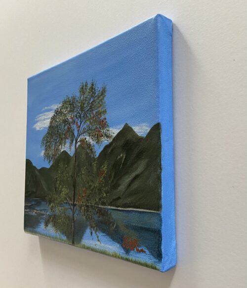 Painting of a leafy tree in front of a lake with mountains in the background