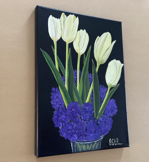 A painting of white tulips set into a glass vase of purple blooms