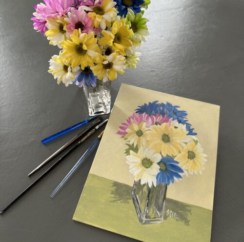 A painting of brightly coloured daisies in a clear rectangular vase