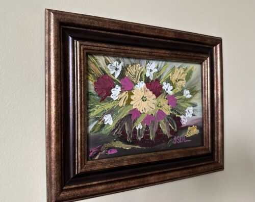 A palette knife painting of pink and yellow flowers in a basket