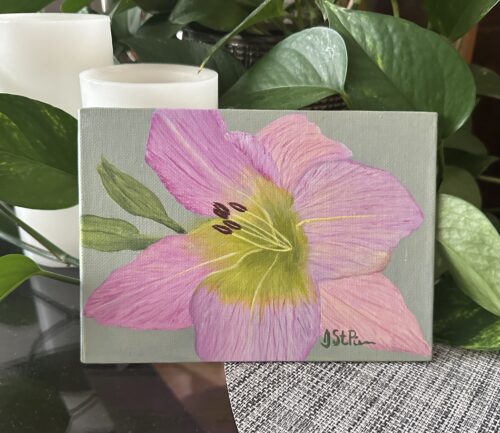 A framed painting of a pink lily on a green background