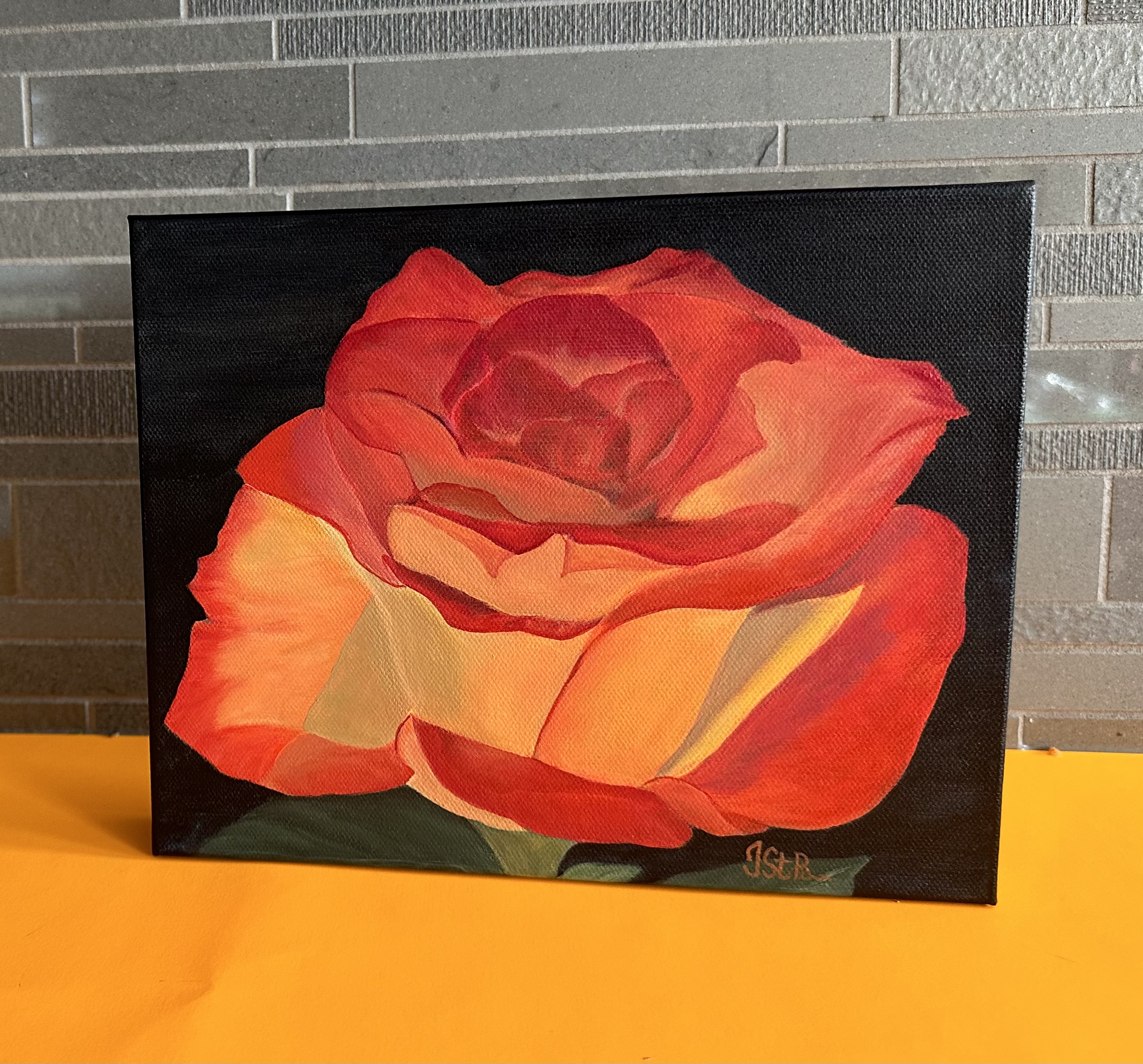 A painting of a beautiful red and orange rose bloom on a dark background