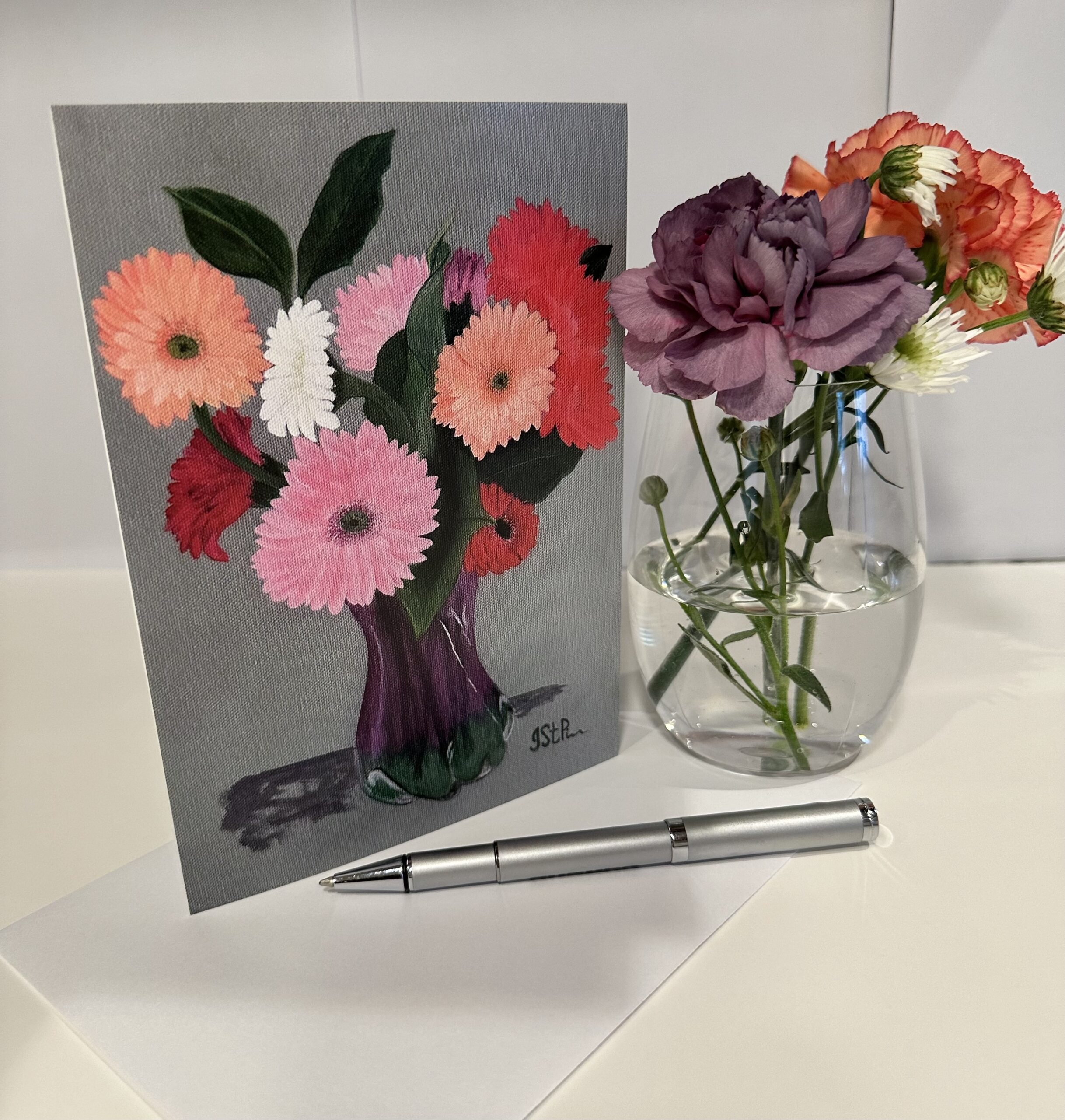 An art print notecard of my acrylic painting of gerbera daisies in a glass vase